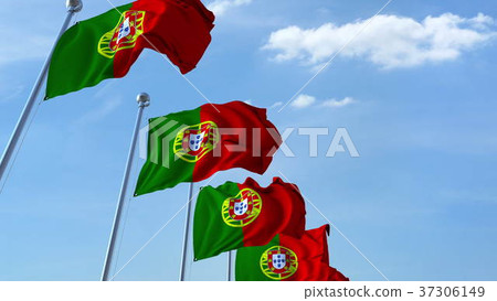 Multiple waving flags of Portugal against the blue Multiple waving flags of Portugal against the blue 37306149