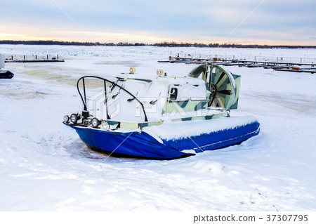 Hovercraft transporter on the ice of river  37307795