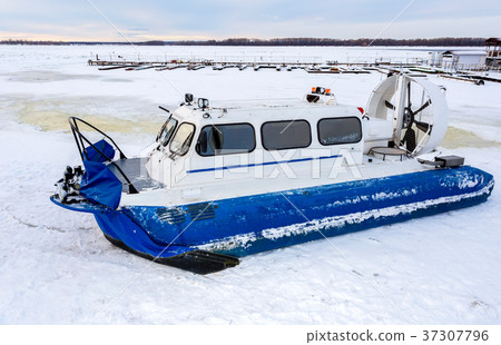 Hovercraft transporter on the ice of river  37307796