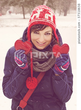 Young woman with two hearts in the hands Young woman with two hearts in the hands 37318638
