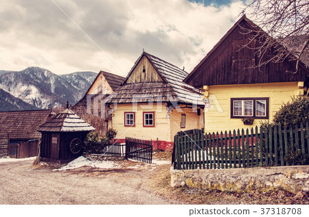 Colorful wooden houses in Vlkolinec village Colorful wooden houses in Vlkolinec village 37318708