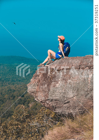 woman hiker enjoy the view on cliff edge woman hiker enjoy the view on cliff edge 37319251
