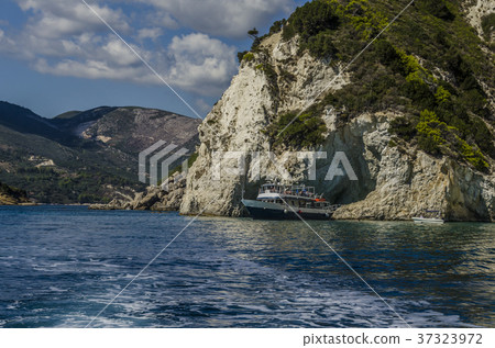 Tourist boat leaving zakynthos cave 37323972