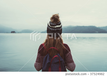 Lonely woman standing absent minded Lonely woman standing absent minded 37324982