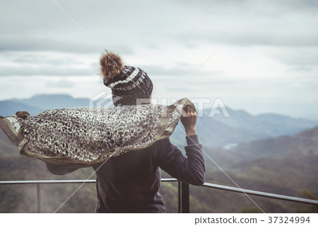 Lonely woman standing absent minded 37324994