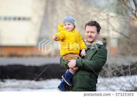 Middle age father with his little son together Middle age father with his little son together 37325303