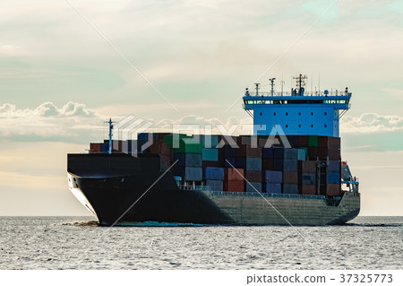 Black container ship underway Black container ship underway 37325773
