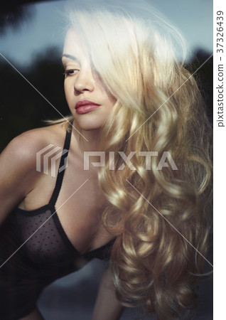 Blonde in bed in the sun 37326439