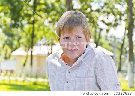 Portrait of blond boy in sunlight Portrait of blond boy in sunlight 37327658