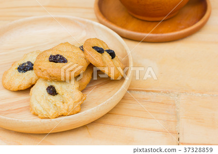 coffee cookies with raisins on wooden table coffee cookies with raisins on wooden table 37328859