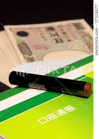 Savings passbook, cash and a seal Savings passbook, cash and a seal 37329877