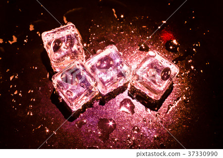 Red ice cubes and water drop background. Red ice cubes and water drop background. 37330990