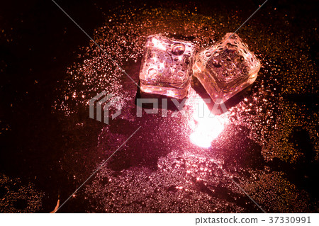 Red ice cubes and water drop background. Red ice cubes and water drop background. 37330991