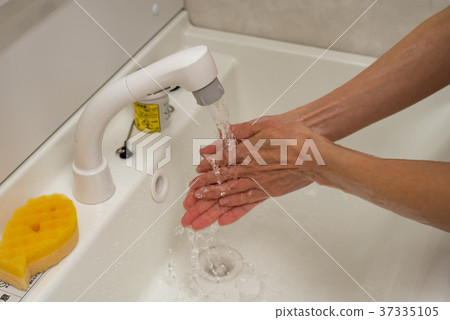 Women wash their hands Women wash their hands 37335105