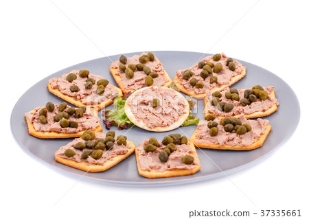 Meat pate with capers on crackers 37335661