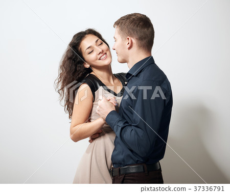 romantic couple posing on white background  37336791