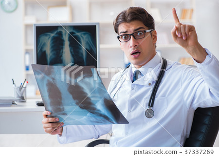 Doctor radiologist looking at x-ray images 37337269