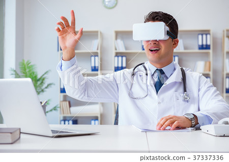 Young doctor with vr virtual reality headset Young doctor with vr virtual reality headset 37337336