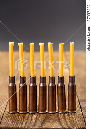 Candles and empty rifle cartridges. 37337362