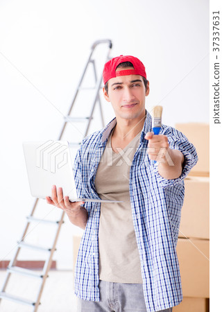 Young painter contractor choosing colors for home Young painter contractor choosing colors for home 37337631