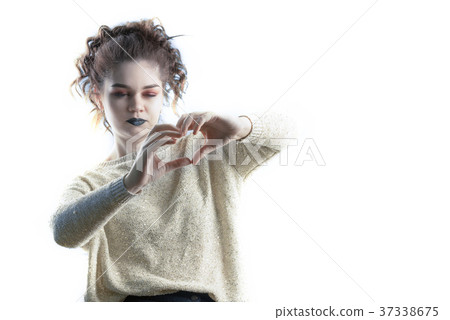 girl with a heart symbol from her fingers girl with a heart symbol from her fingers 37338675