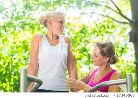Women doing gymnastics together in summer outdoor 37340066