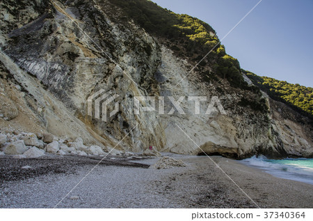 mountain plunging over the beach  myrtos kefalonia 37340364