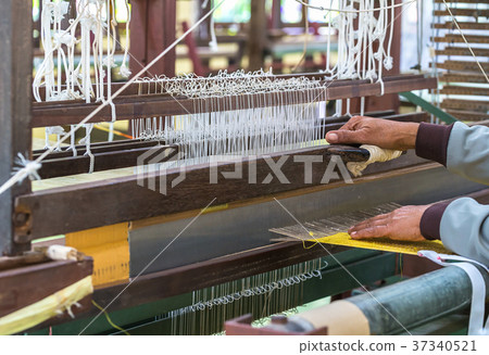 Weave silk cotton on the manual wood loom Weave silk cotton on the manual wood loom 37340521