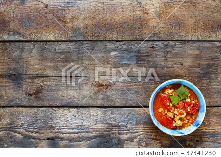 Indian dish of yellow lentils in a blue bowl  37341230