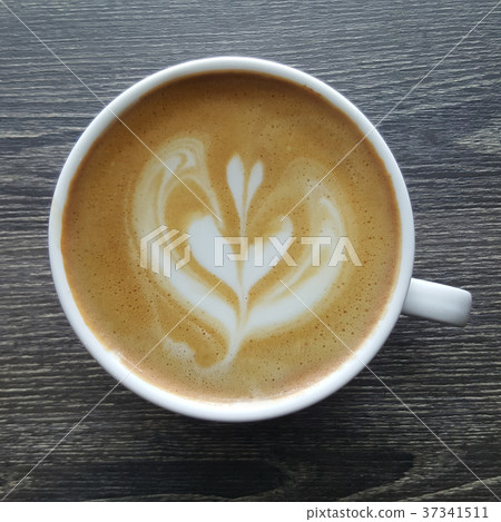 Top view of a mug of latte art coffee. Top view of a mug of latte art coffee. 37341511