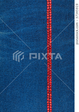 Line made of blue crystals on blue denim fabric. Line made of blue crystals on blue denim fabric. 37345919