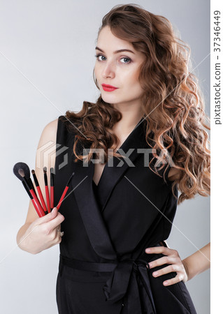woman make-up artist with natural make-up holding woman make-up artist with natural make-up holding 37346449