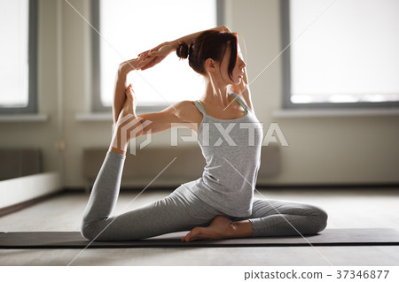 Young sporty woman doing yoga stretching exercise 37346877
