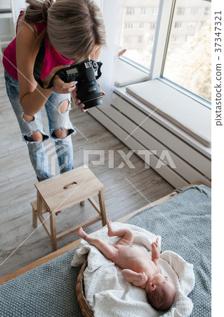 working process newborn baby photoshoot woman working process newborn baby photoshoot woman 37347321