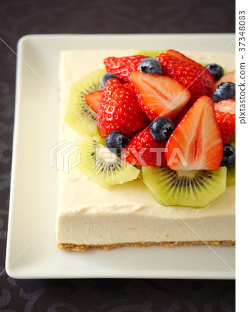 Strawberry and kiwi rare cheese cake black background Strawberry and kiwi rare cheese cake black background 37348083