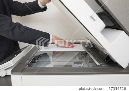 Businessman hand using a copy machine 37354726