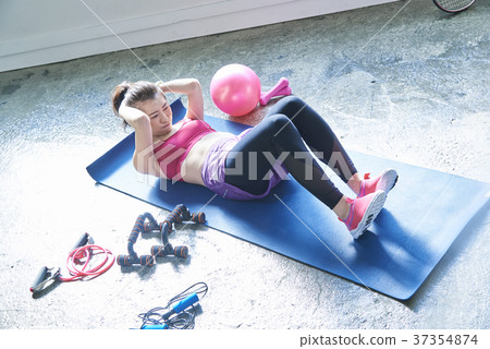 A woman sitting upright 37354874