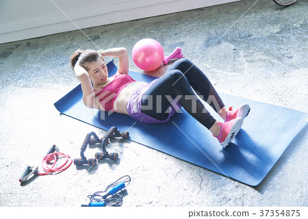 A woman sitting upright 37354875