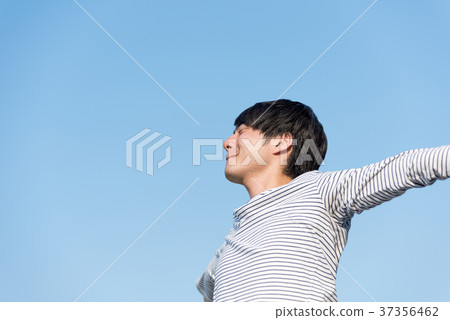 Young men relaxing under the blue sky Young men relaxing under the blue sky 37356462