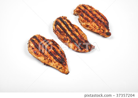 Chicken meat. Grilled fillet pieces isolated on Chicken meat. Grilled fillet pieces isolated on 37357204