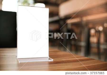 Mock up Menu frame standing on wood table Mock up Menu frame standing on wood table 37357865