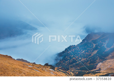 mountain landscape with clouds above the peaks 37358610