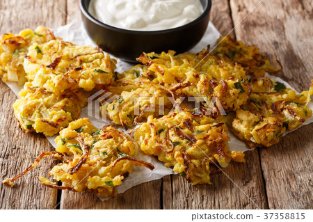 Tasty Indian food bhaji and yogurt close-up Tasty Indian food bhaji and yogurt close-up 37358815