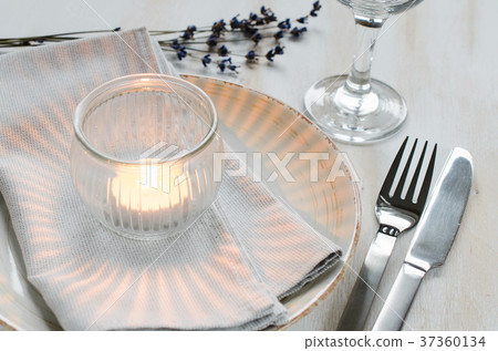Festive table setting with candles and lavender. 37360134