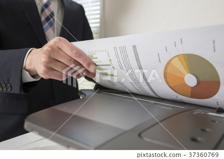 Businessman hand using a copy machine 37360769