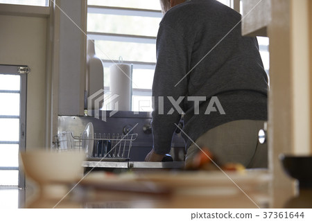 Senior standing in the kitchen Senior standing in the kitchen 37361644