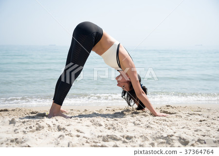 Fitness Girl working out on the beach 37364764