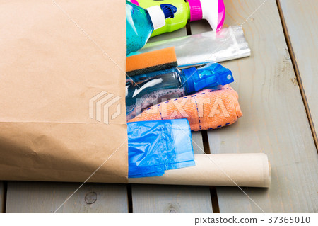 Full paper bag of different house cleaning produc 37365010