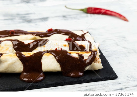 Mexican chicken enchiladas with chili chocolate Mexican chicken enchiladas with chili chocolate 37365174