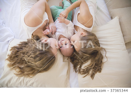 three sisters play children in the morning in the 37365344